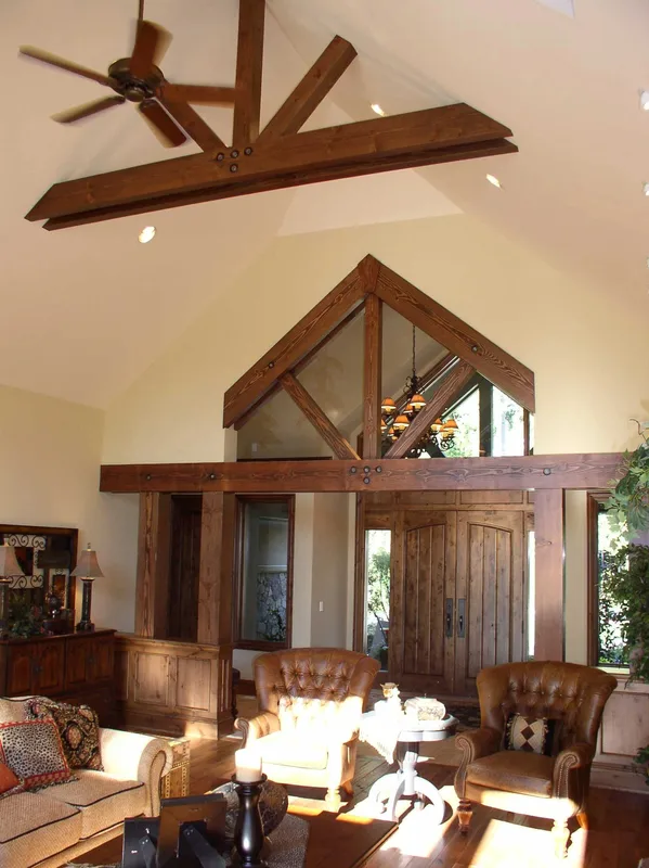 Woodinville Craftsman: Tall view of the entry and great room beneath exposed ceiling beams