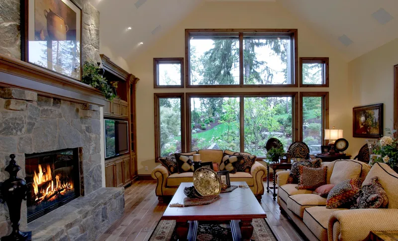 Woodinville Craftsman: Stone fireplace and window wall viewed across the living room