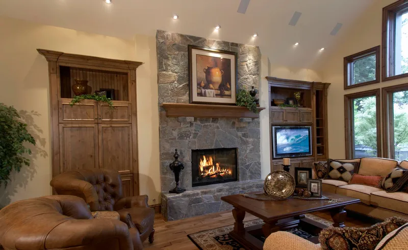 Woodinville Craftsman: Living room fireplace, built-in television and seating