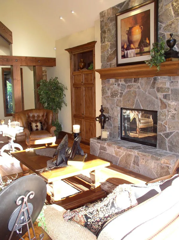Woodinville Craftsman: Sunlit seating beside the stone fireplace