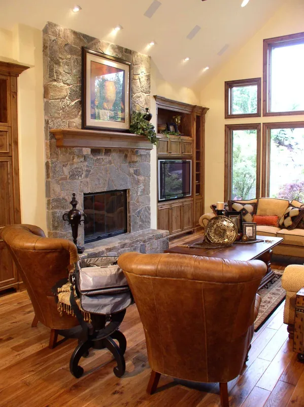 Woodinville Craftsman: Leather chair beside the great room fireplace