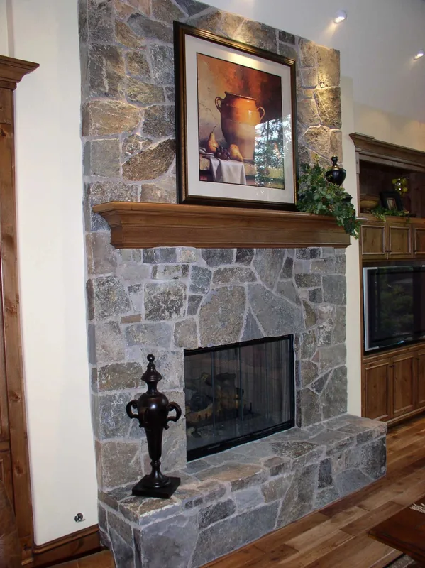 Woodinville Craftsman: Close view of the stone fireplace and wood mantel