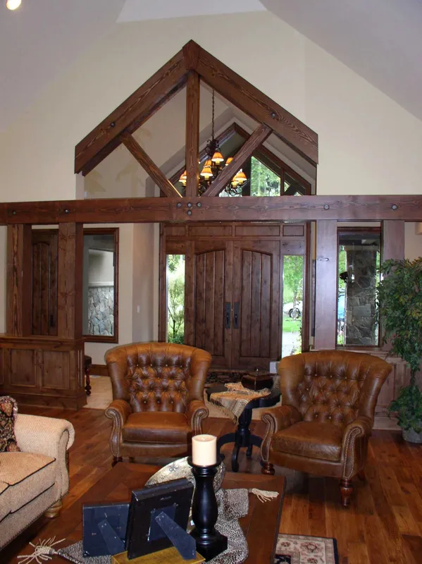 Woodinville Craftsman: Entry sitting area beneath a timber-framed gable