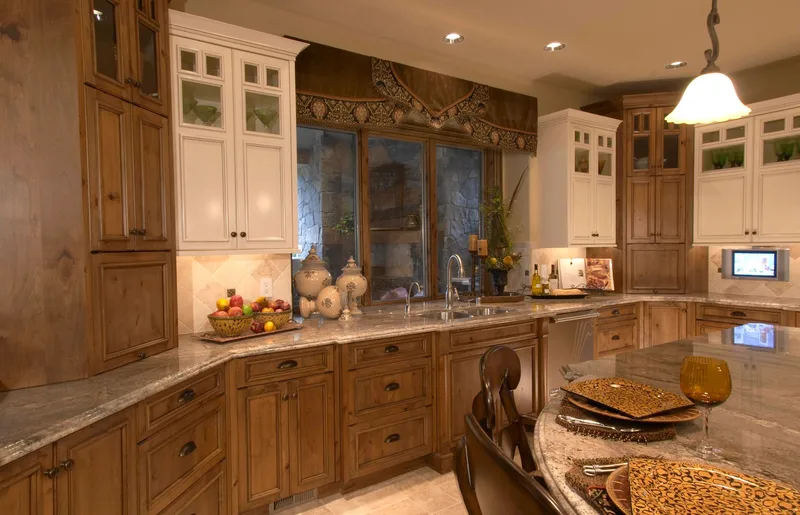 Woodinville Craftsman: Kitchen sink wall with wood and glass-front cabinetry