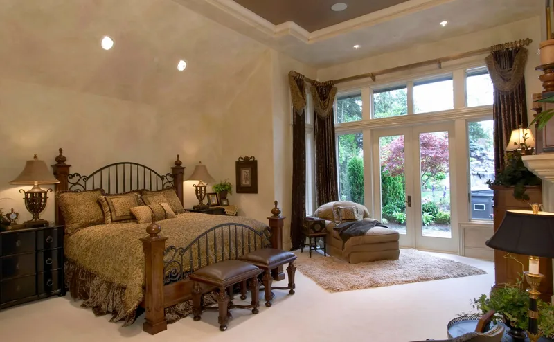 Woodinville Craftsman: Bedroom with tall glass doors opening toward the garden
