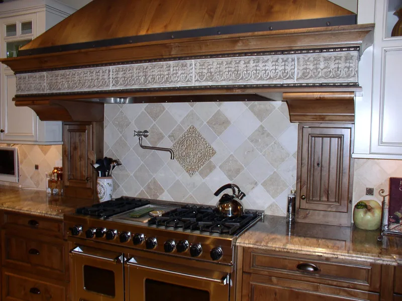 Woodinville Craftsman: Close view of the range, tilework and carved hood trim