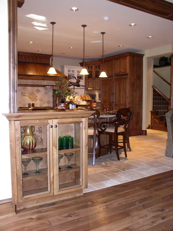 Woodinville Craftsman: View into the kitchen through the wood-trimmed opening