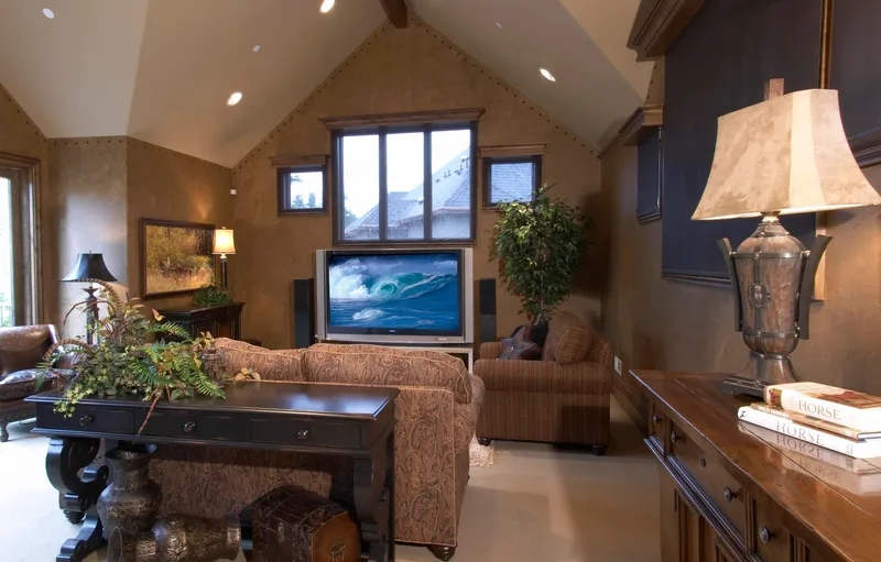 Woodinville Craftsman: Upper sitting room with a television and gabled window