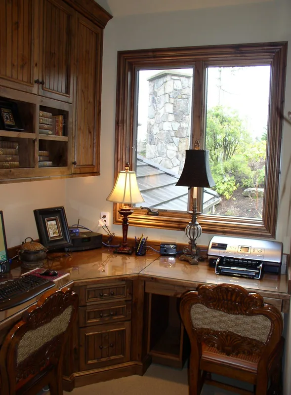 Woodinville Craftsman: Study nook with wood cabinetry and a garden-facing window