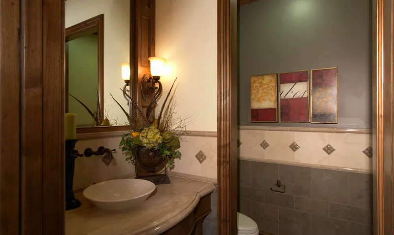 Woodinville Craftsman: Powder room with a vessel basin and wood-trimmed walls