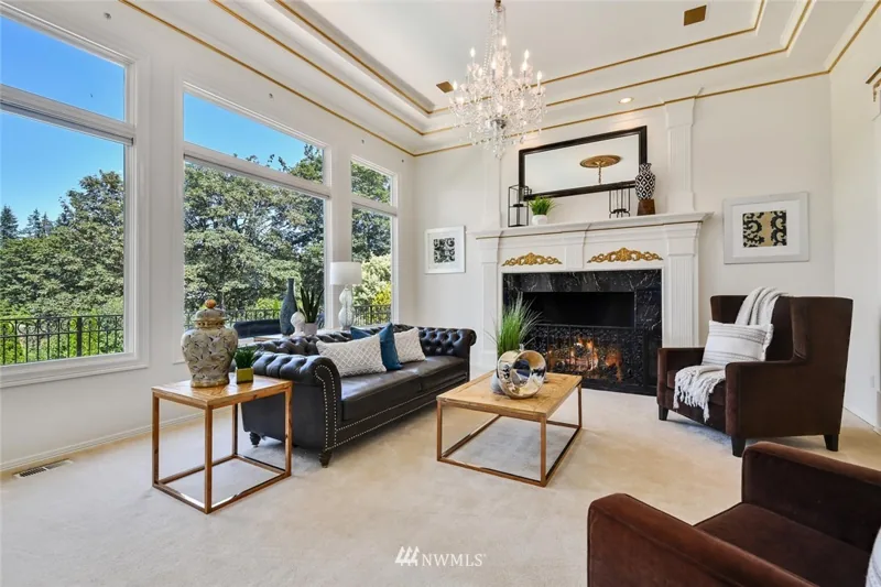 Living room with tall windows and a fireplace