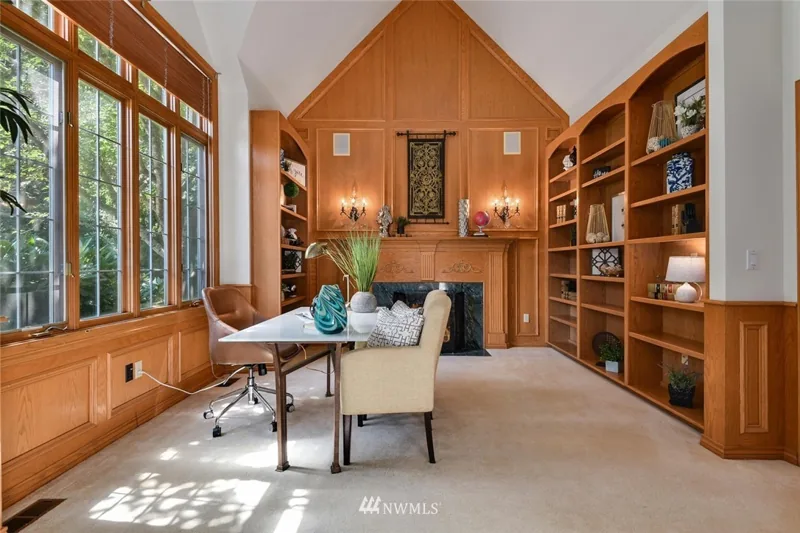 Wood-paneled study with built-in shelves