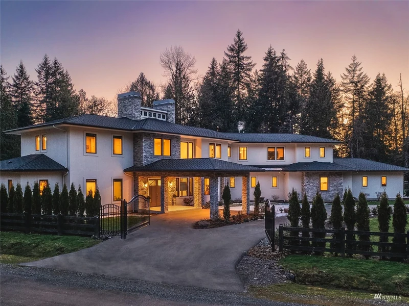 Front entrance and courtyard of the Woodinville home at dusk
