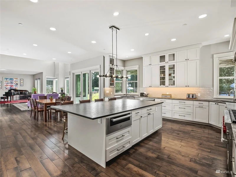 Open kitchen island overlooking the dining and living spaces