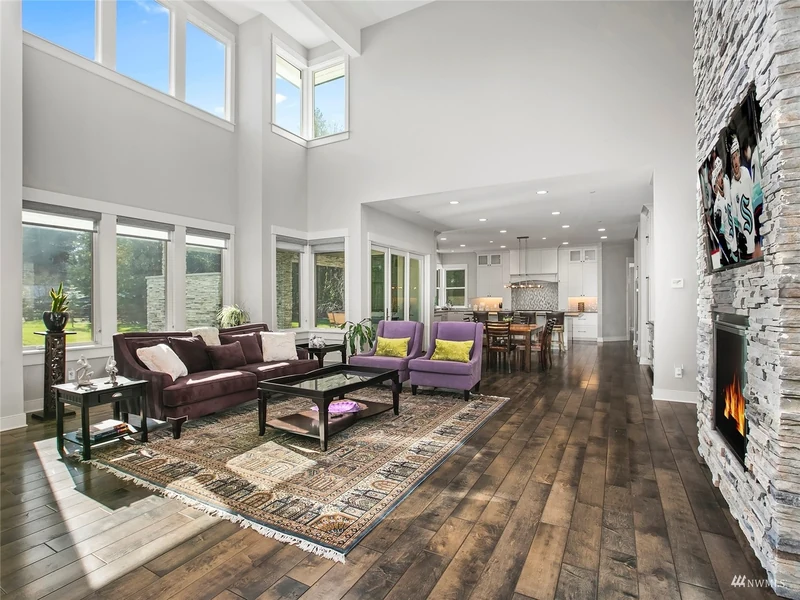 Great room with upper windows and views toward the covered patio