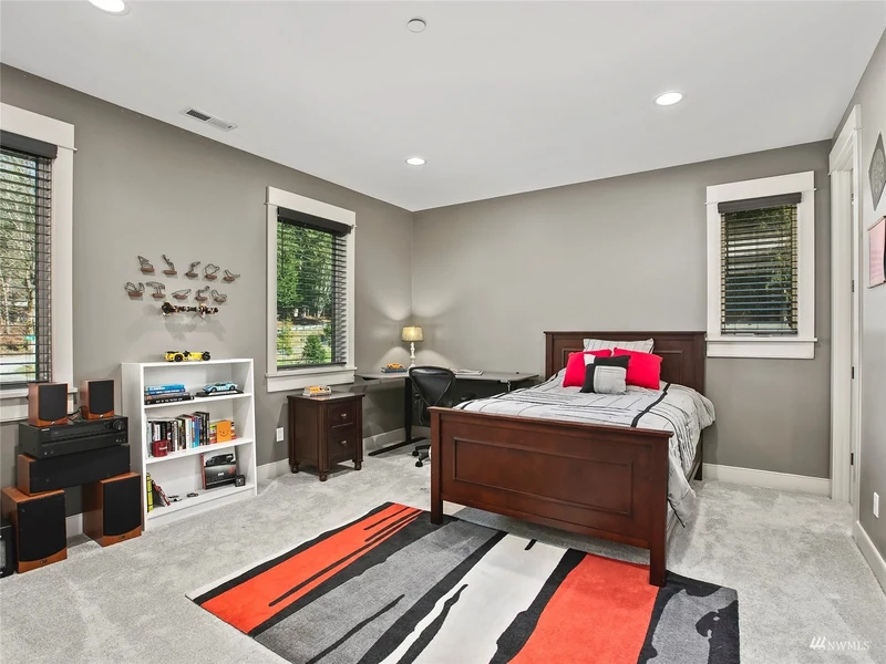 Bedroom with a desk and display shelving