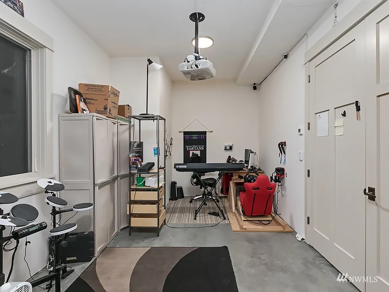 Exercise room with fitness equipment and a ceiling fan