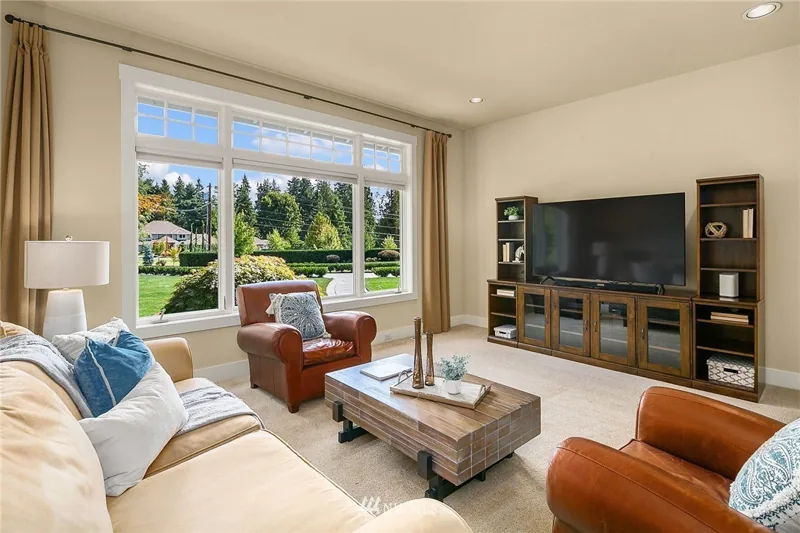 Living room with large garden-facing windows