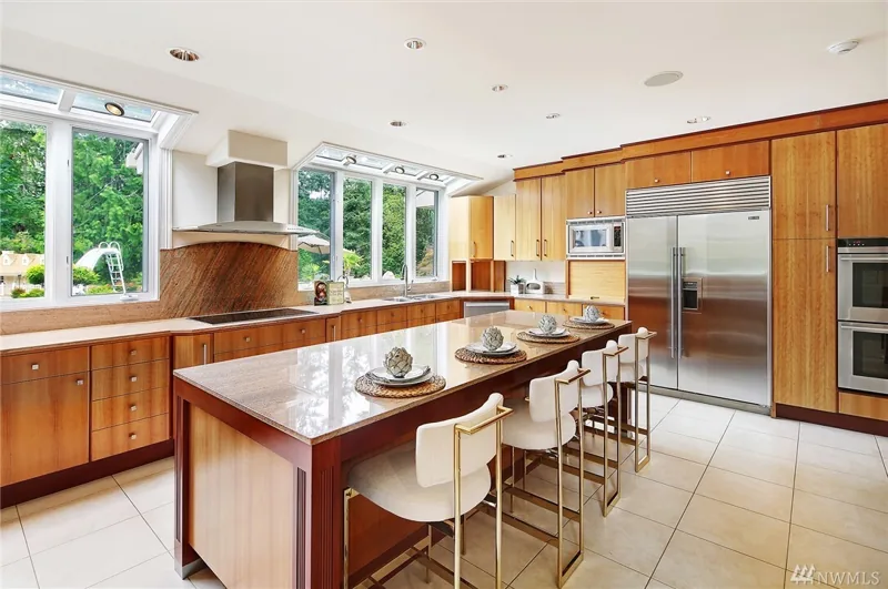 Wood-cabinet kitchen with a large island