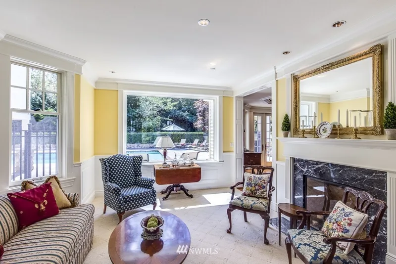Living room with a fireplace and bay window