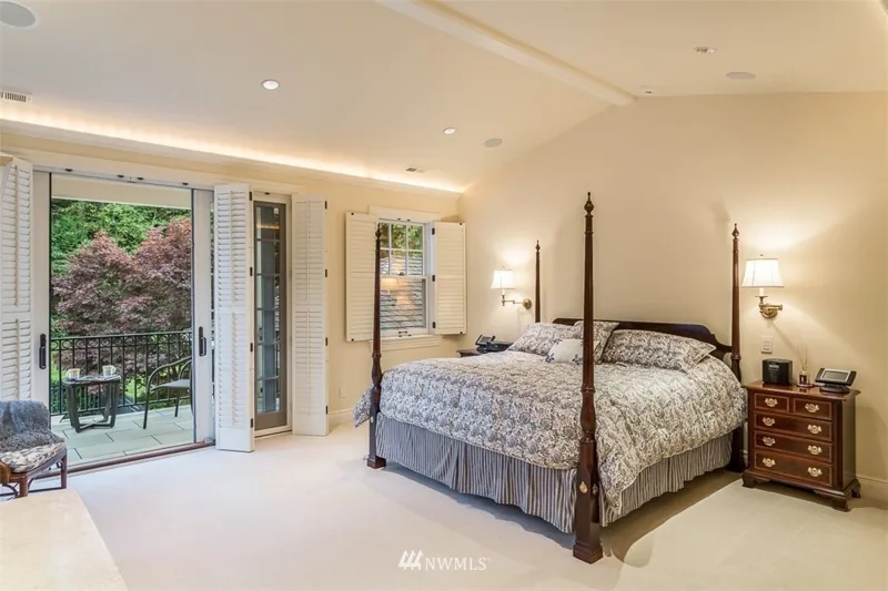 Bedroom with glass doors opening to a balcony