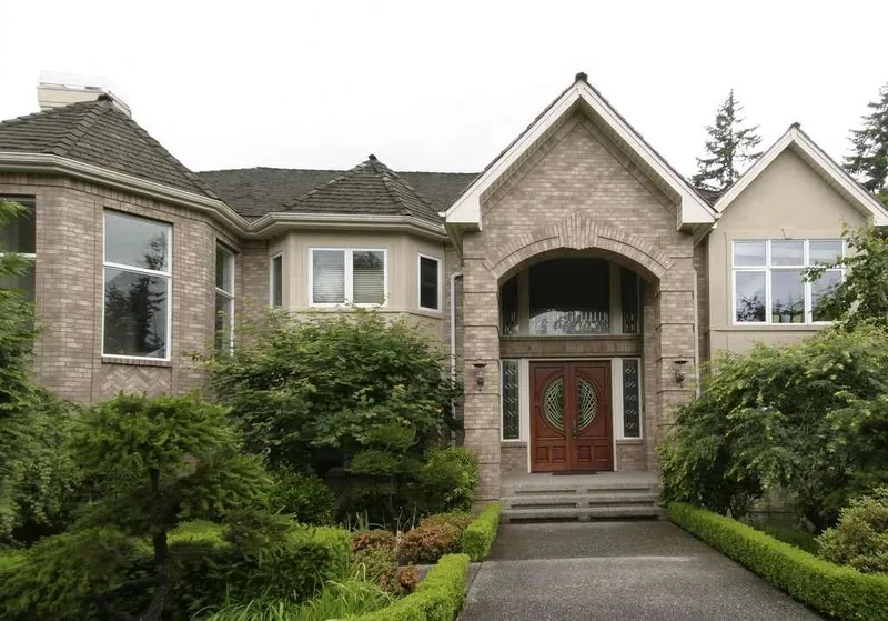 Woodinville, wine room and pool: Woodinville home with a stone-faced entry and landscaped front walk
