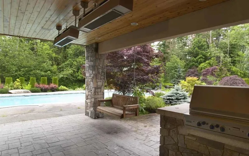 Woodinville, wine room and pool: Outdoor grill and covered terrace beside the pool