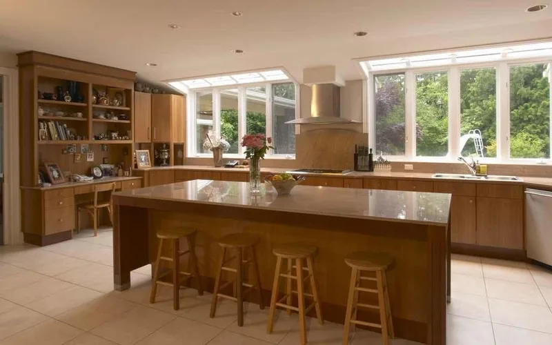 Woodinville, wine room and pool: Kitchen with a broad island and windows around the sink wall