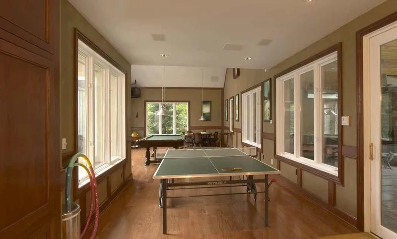 Woodinville, wine room and pool: Table-tennis area beside a long wall of windows