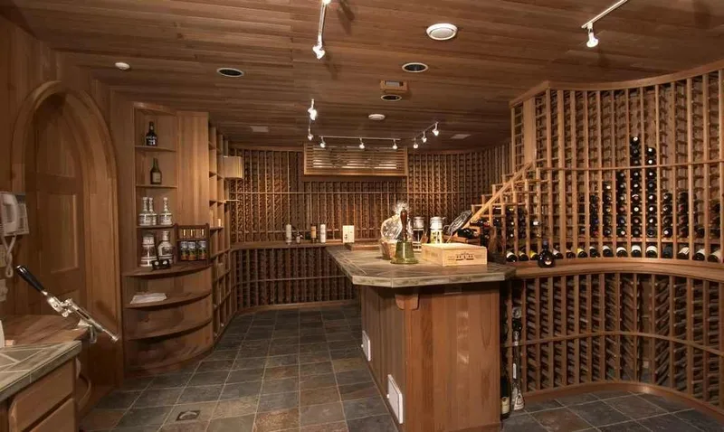 Woodinville, wine room and pool: Wine room with extensive bottle storage and a central tasting island