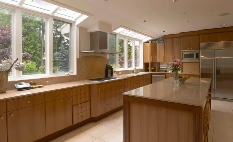 Woodinville, wine room and pool: Kitchen sink wall beneath skylights and garden-facing windows