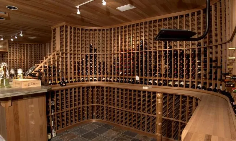 Woodinville, wine room and pool: Curved wine racks and tasting counter beneath a wood ceiling
