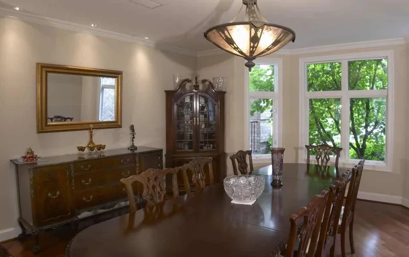 Woodinville, wine room and pool: Dining room with a chandelier and garden windows