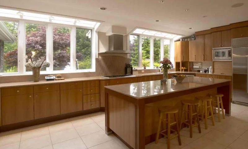 Woodinville, wine room and pool: Wood kitchen cabinetry and island with counter seating