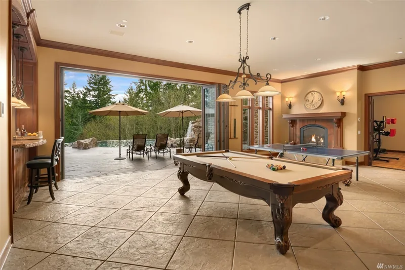 Billiards room opening onto an outdoor terrace
